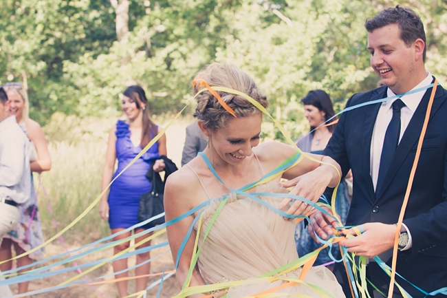 Streamers!  Gorgeous Eco Friendly Outdoor Forest Wedding ceremony :: Ruby Jean Photography :: See more on Confetti Daydreams Wedding Blog