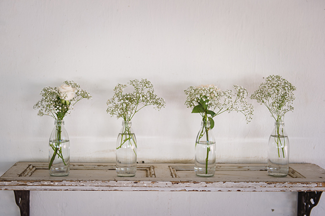 Babys breath in vintage bottles // Vintage Elegance Neutral South African Wedding //Lauren Kriedemann photography // via www.ConfettiDaydreams.com // 