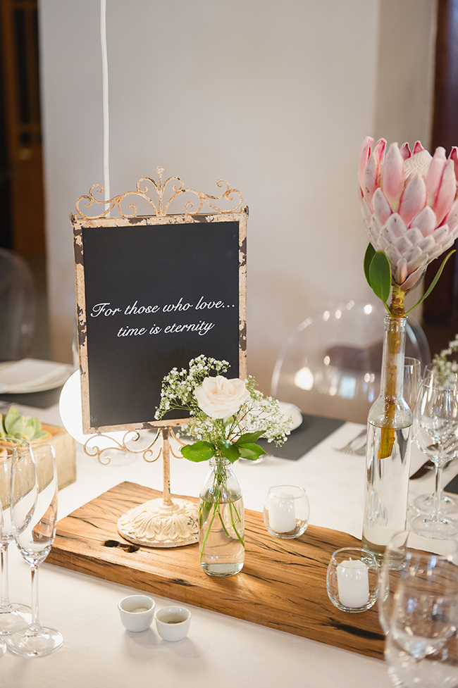 Protea Reception Table Decor // Vintage Elegance Neutral South African Wedding //Lauren Kriedemann photography // via www.ConfettiDaydreams.com // 