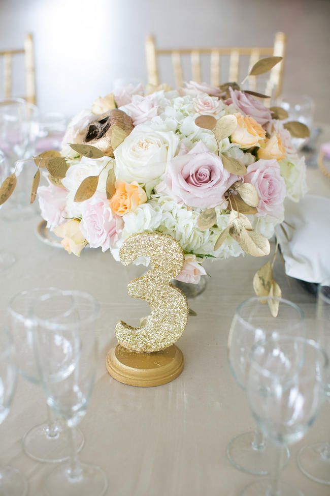 Glitter Table Number and Floral Arrangement // Beautiful Rustic Elegance Wedding in Blush Cream Gold // Carly Fuller Photography // Click for more details on www.ConfettiDaydreams.com