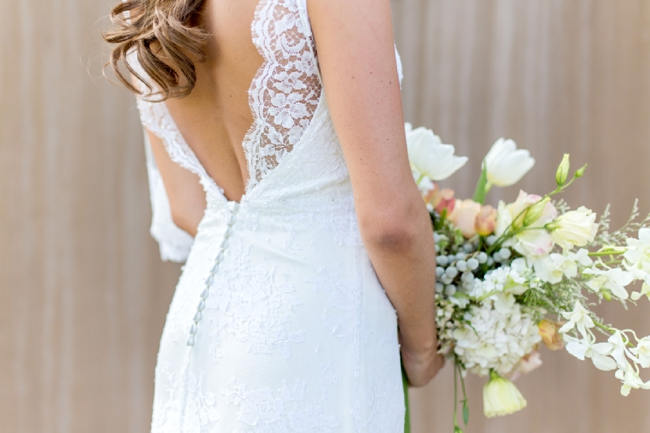 Lace trimmed, open back wedding dress // Franschhoek Wedding // Photography by Claire Nicola
