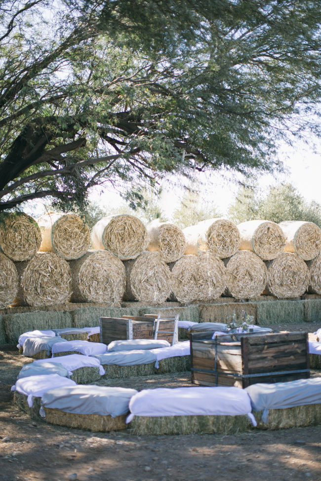 Outdoor seating on hay bales //  Beautiful Gray and Yellow Rustic Winter Wedding Reception Decor / Jenni Elizabeth Photography