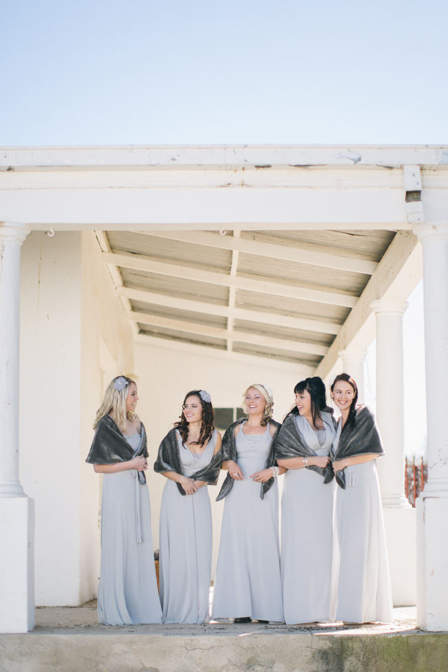 Grey Bridesmaid dresses with winter shrugs // Beautiful Gray and Yellow Winter Wedding / Jenni Elizabeth Photography