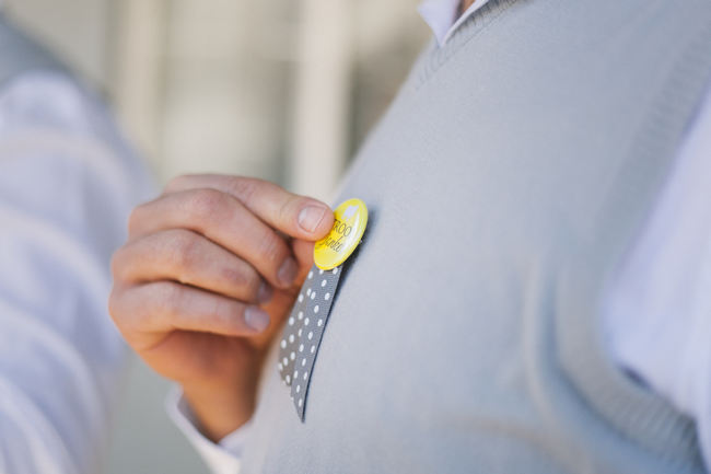 Grey groom pullover and yellow button // Beautiful Gray and Yellow Winter Wedding / Jenni Elizabeth Photography