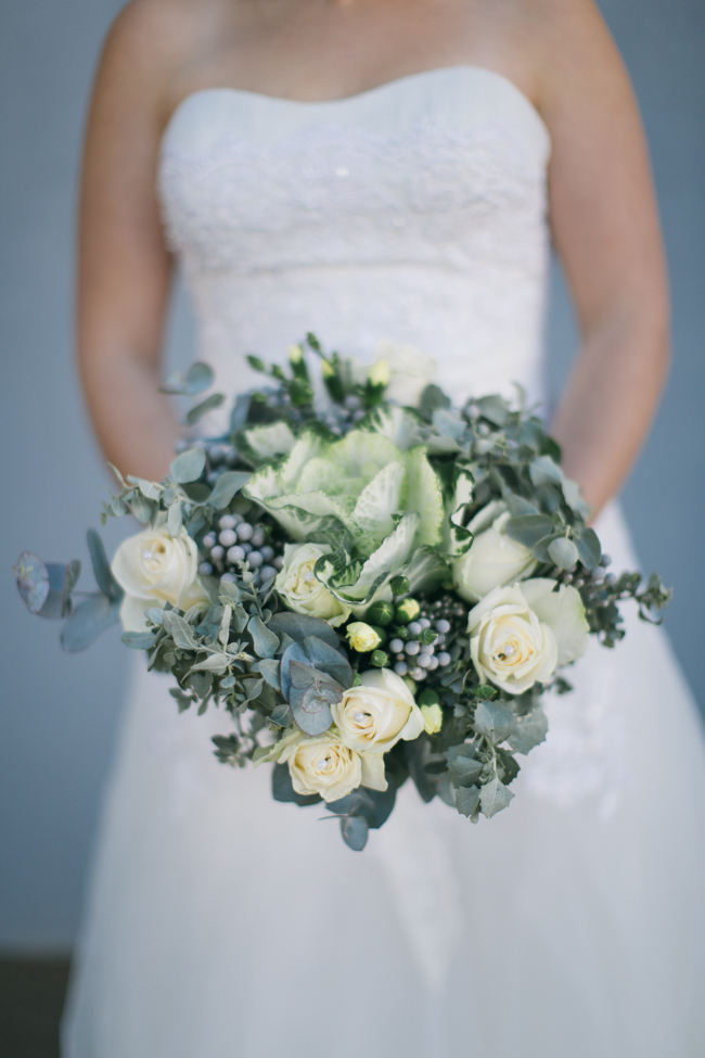 Rustic wedding bouquet from kale. yellow roses, brunia balls and eucalyptus