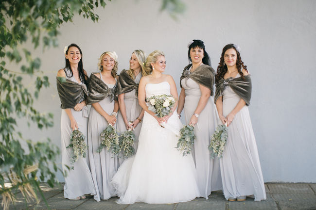 Grey Bridesmaid dresses with winter shrugs // Beautiful Gray and Yellow Winter Wedding / Jenni Elizabeth Photography