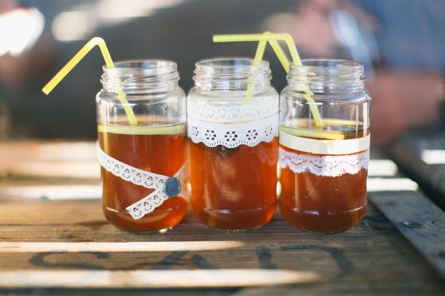 Mason jars with ribbon and yellow straws //  Beautiful Gray and Yellow Rustic Winter Wedding Reception Decor / Jenni Elizabeth Photography