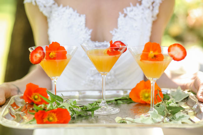 Peach martinis served on silver tray with peach flowers / // Nikki Meyer Photography 
