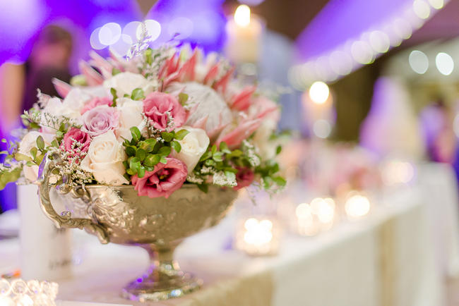 Pink, blush and cream wedding reception table details with stunning King Protea // Lightburst Photography