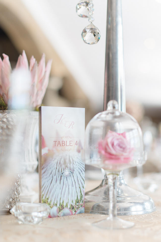 Pink, blush and cream wedding reception table details with stunning King Protea // Lightburst Photography