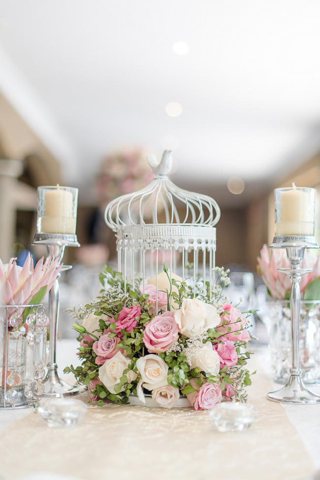 Pink, blush and cream wedding reception table details with stunning King Protea // Lightburst Photography