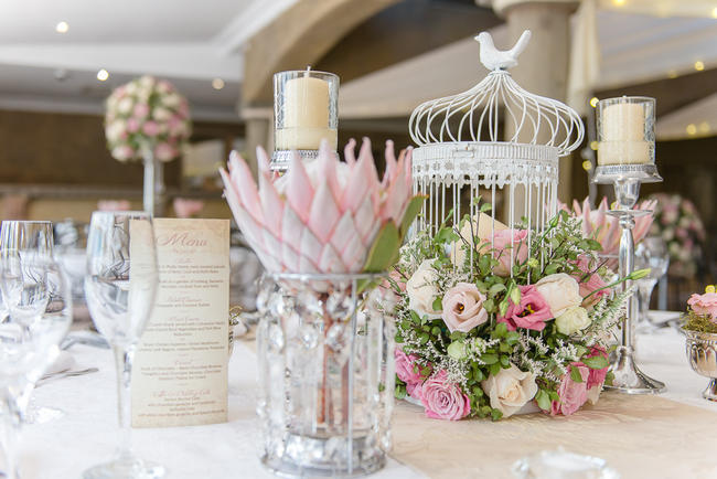 Pink, blush and cream wedding reception table details with stunning King Protea // Lightburst Photography