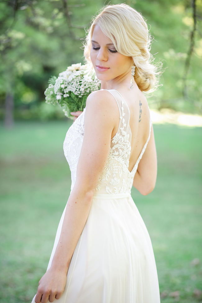  A deep V style Lace back wedding dress shows off tattoo. Lovely Rustic Garden Picnic Wedding // Nikki Meyer Photography