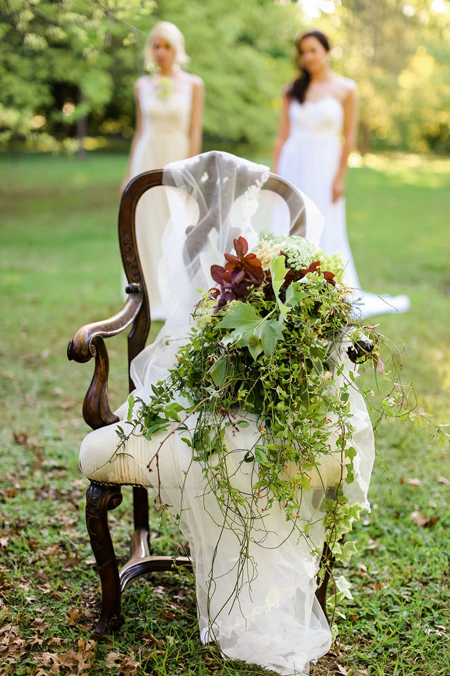 A rustic brown and green cascade fall wedding bouquet using steams and leaves for a Rustic Garden Picnic Wedding // Nikki Meyer Photography