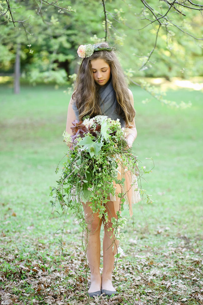 A rustic brown and green cascade fall wedding bouquet using steams and leaves for a Rustic Garden Picnic Wedding // Nikki Meyer Photography