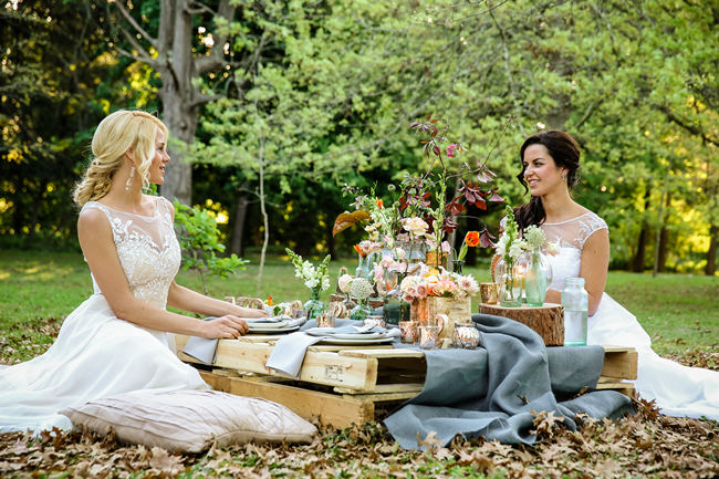 A pretty pallet picnic table using grey hessian burlap runner, filled with rustic decor elements, mercury votives, wood slabs and peach blooms in mix and match vases. Rustic Garden Picnic Wedding // Nikki Meyer Photography