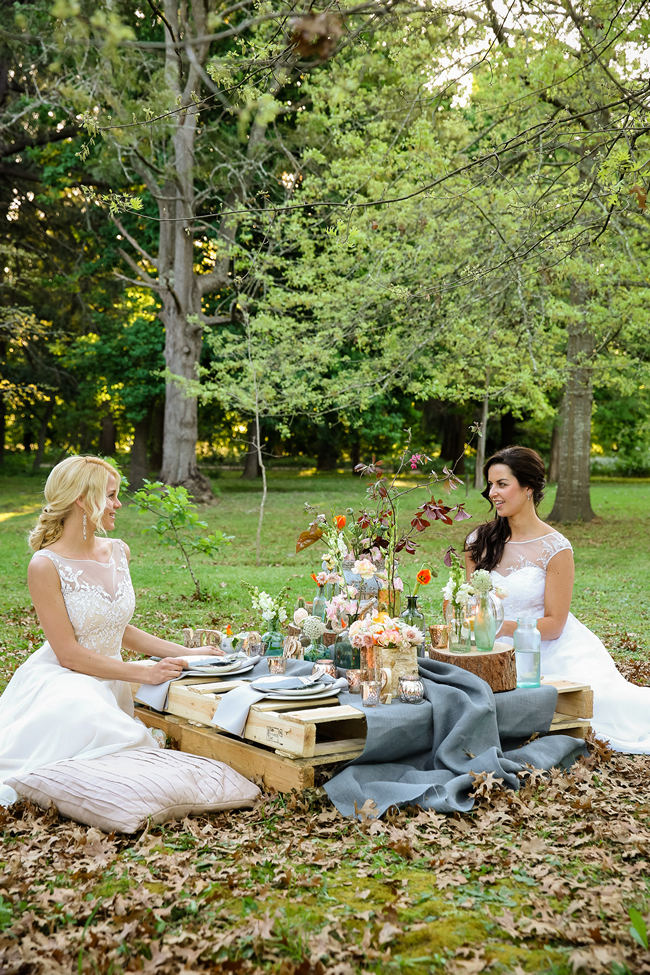 A pretty pallet picnic table using grey hessian burlap runner, filled with rustic decor elements, mercury votives, wood slabs and peach blooms in mix and match vases. Rustic Garden Picnic Wedding // Nikki Meyer Photography