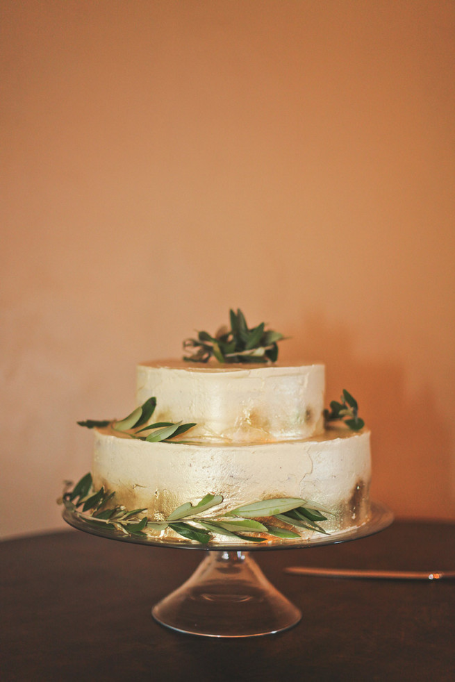 Two tiered gold dusted cake with leaves and laurels . Green White Rustic South African Wedding // Justin Davis Photography