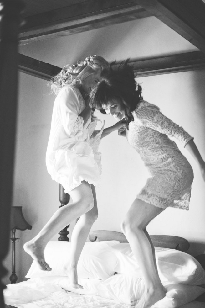 Bridesmaids jumping on bed . Green White Rustic South African Wedding // Justin Davis Photography