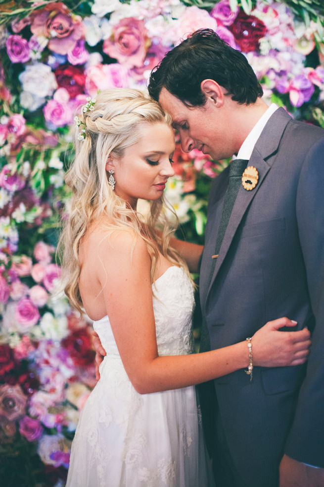 Long wedding hair idea. Groom in grey suit with grey tie. Green White Rustic South African Wedding // Justin Davis Photography