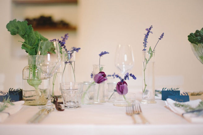 Single stem lavender and purple tulips in glass vases. Simple and effective. Gorgeous Navy Gold Wedding at Babylonstoren / Charlene Schreuder Photography 