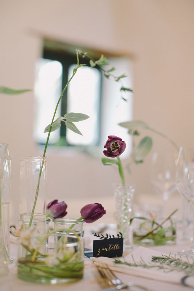 Single stem lavender and purple tulips in glass vases. Simple and effective. Gorgeous Navy Gold Wedding at Babylonstoren / Charlene Schreuder Photography 