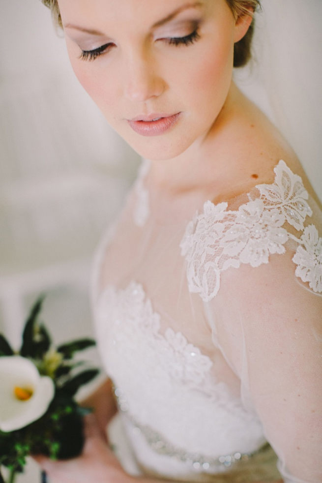 Exquisite bridal gown with sheer illusion sleeves and lace tattoo detail by Elizabeth Stockenstrom. Click to see the Navy Gold Wedding at Babylonstoren / Charlene Schreuder Photography 