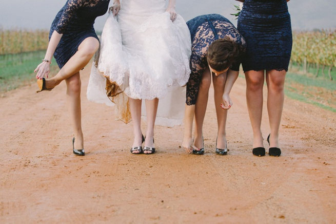 CUTE! Bridesmaids in short navy dresses with long lace sleeves