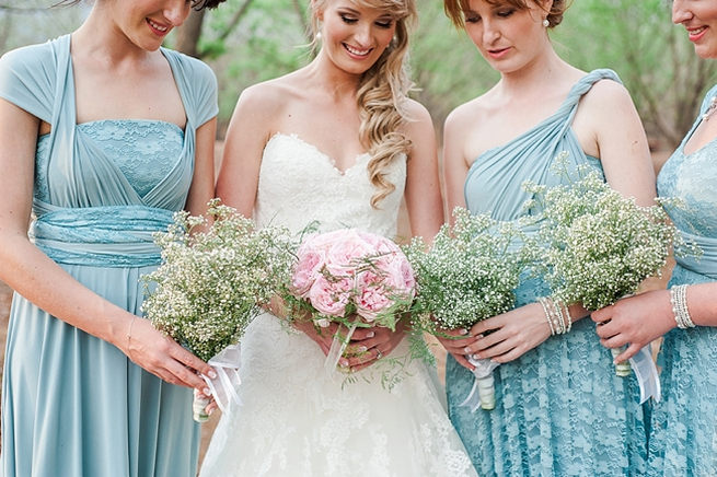 Bridesmaids wearing mismatched blue dress, with babys breath bouquet. Pink peony bridal bouquet. Blush Pink and Powder Blue Spring Wedding // D’amor Photography