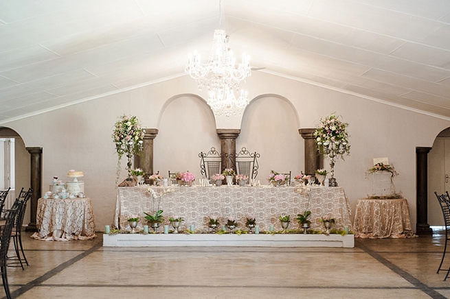 Spectacular arrangements of blooms all around the sweethear bridal table. Blush Pink and Powder Blue Spring Wedding // D’amor Photography