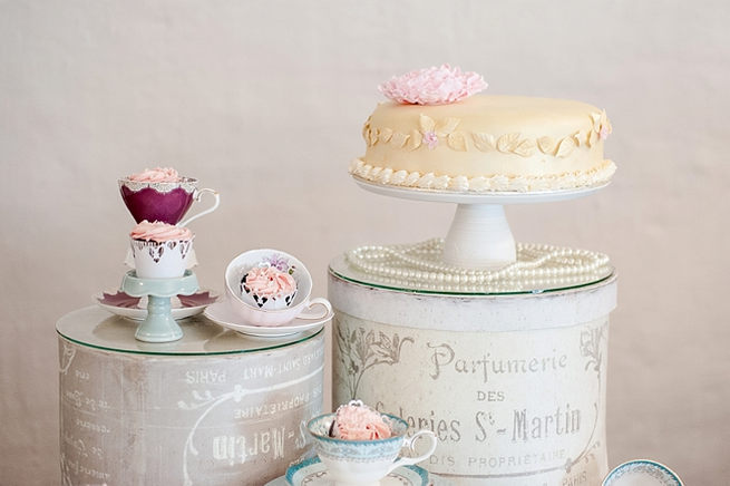 Whimsical cake table in pastel shades with teacups and goods baked by brides mom. Lazer cut Mr and Mrs Signs. Blush Pink and Powder Blue Spring Wedding // D’amor Photography