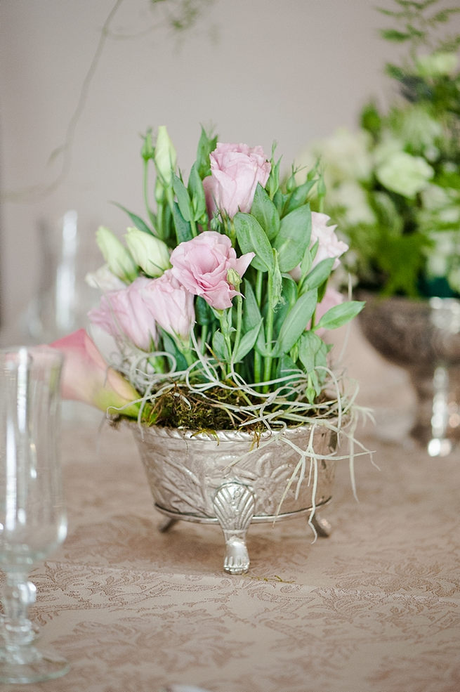 Blush and pink wedding flowers in silver urns and vases on wedding reception tables: hydrangea, roses, lisanthius and leatherleaf ferns // D’amor Photography