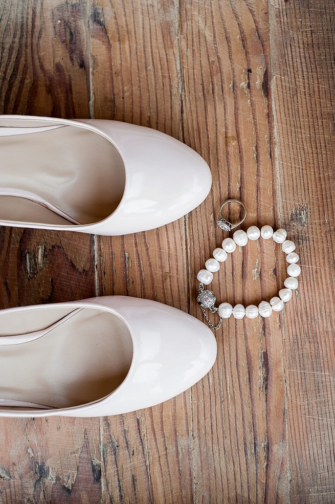 White ballet pump style wedding shoes are so pretty!