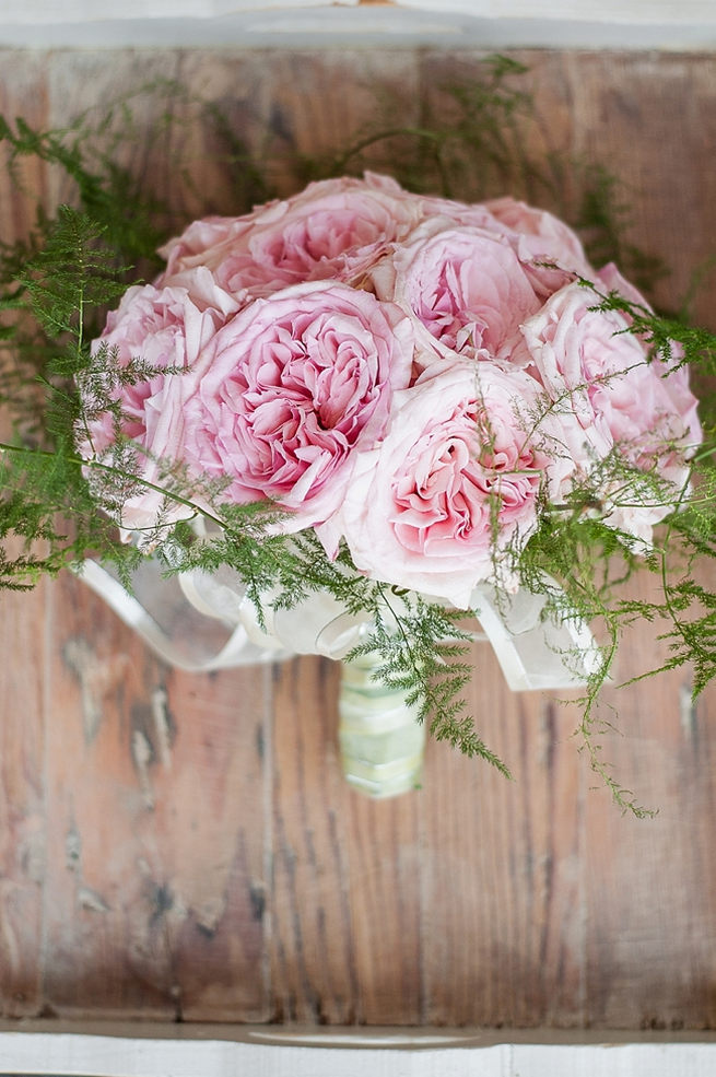 Wedding bouquet of baby pink peonies and leatherleaf ferns // D’amor Photography