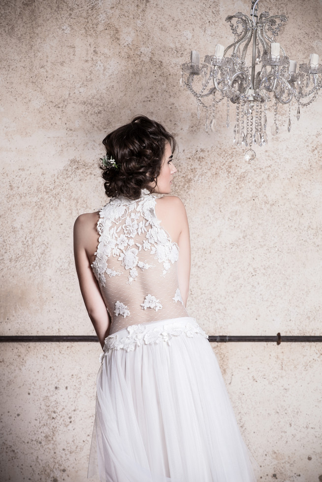 Lace backed wedding dress with flower embroidered on sheer fabrice . Ramon Herrerías Wedding Dresses 