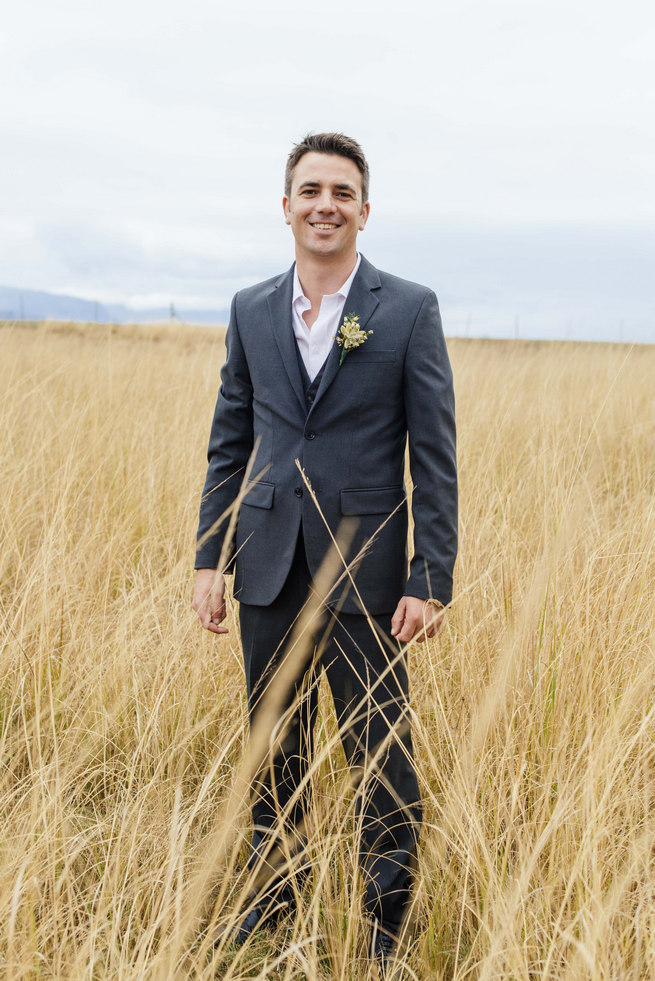 Grooms charcoal grey suit with succulent boutonniere