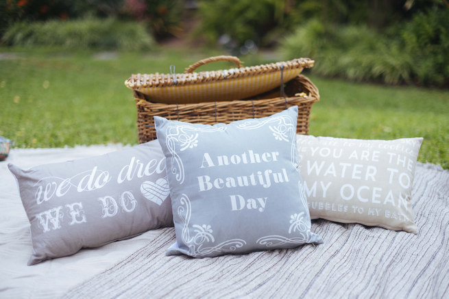 Wedding picnic area with blankets and cushions // Succulent Garden Wedding // Claire Thomson Photography