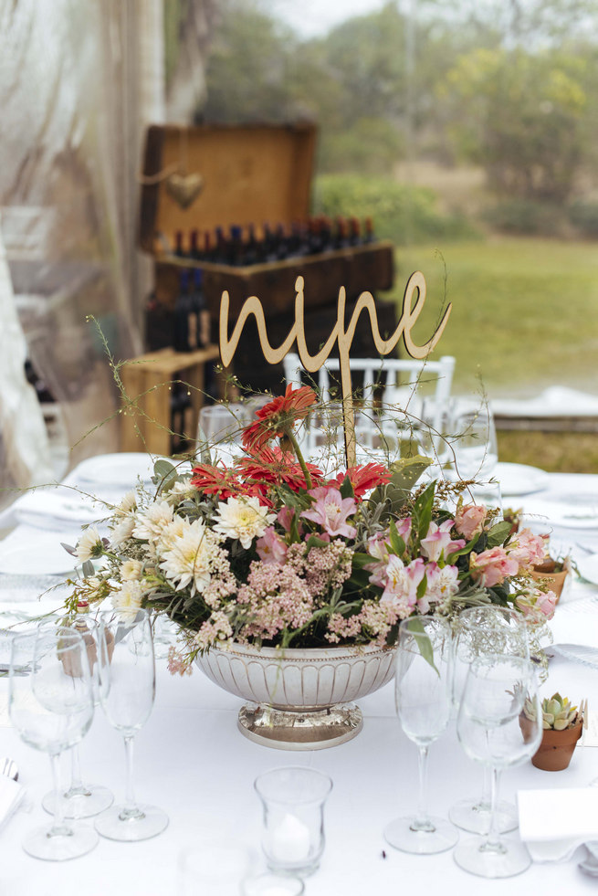 Tablescape with Succulent centerpiece arrangement with lazer cut table number // Succulent Garden Wedding // Claire Thomson Photography