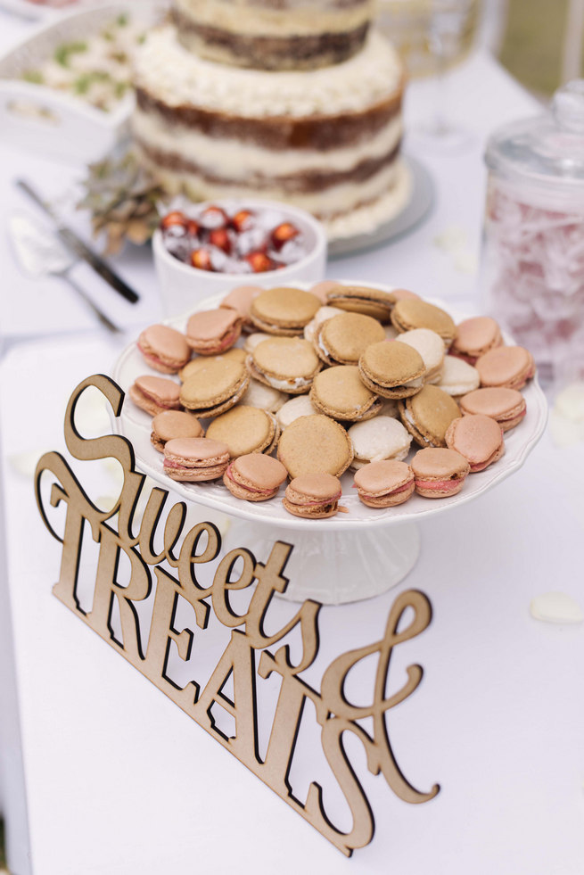 Lazer cut wood sign: Sweets and Treats with macarons on dessert buffet // Succulent Garden Wedding // Claire Thomson Photography