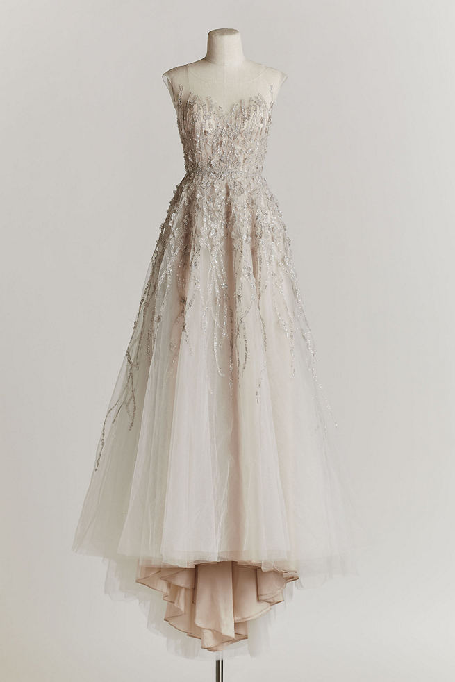 Vintage Wedding Dress: This BHLDN exclusive, designed by Watters, is created with delicate strips of metallic tulle of divine layers of delicate tulle. BHLDN talks about this gown as one with a fairy tale ending, and we agree!