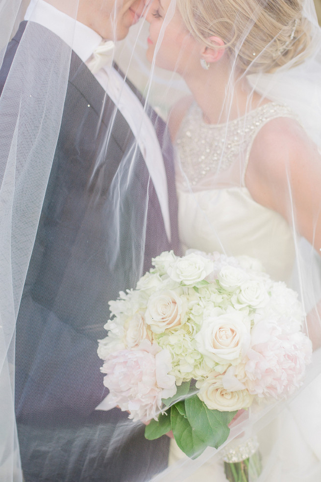 Uber romantic couple photos under a dreamy veil. Glamorous Gatsby Inspired Wedding by Elyse Hall Photography