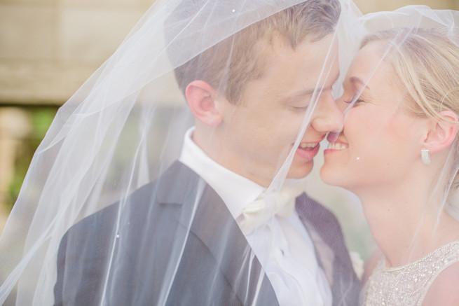 Uber romantic couple photos under a dreamy veil. Glamorous Gatsby Inspired Wedding by Elyse Hall Photography