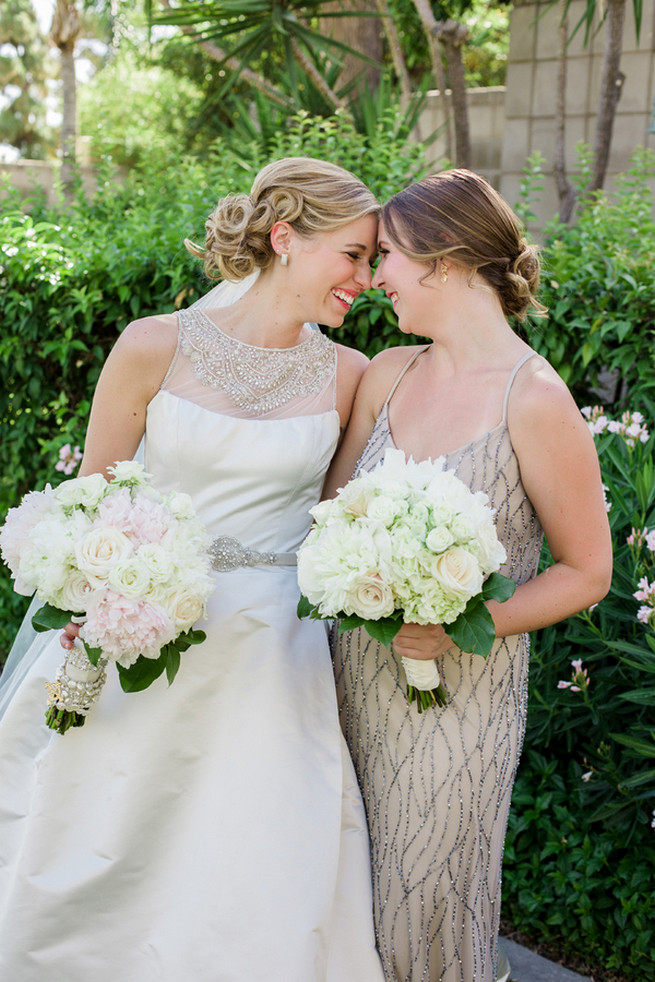 Elegant vintage style bride with champagne bridesmaids gown and white fluffy bouquets. Glamorous Gatsby Inspired Wedding by Elyse Hall Photography