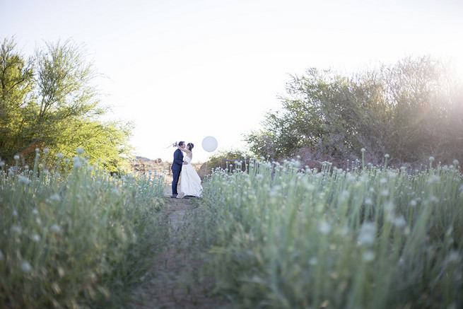  Couple wedding photographs in a field of onion flowers // Organic Farm Style Karoo Wedding // christine Le Roux Photography