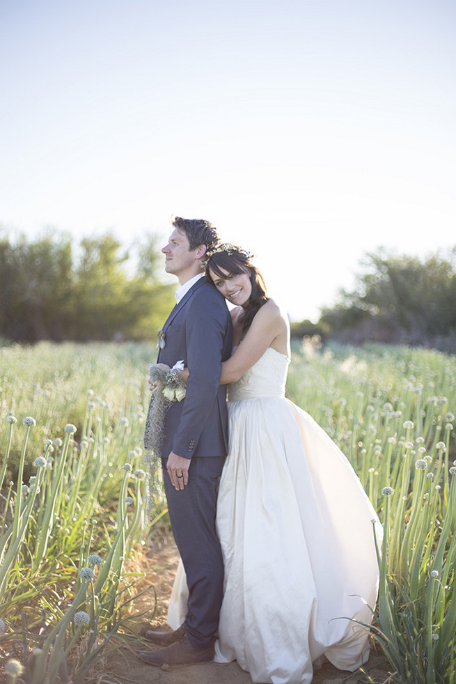  Couple wedding photographs in a field of onion flowers // Organic Farm Style Karoo Wedding // christine Le Roux Photography