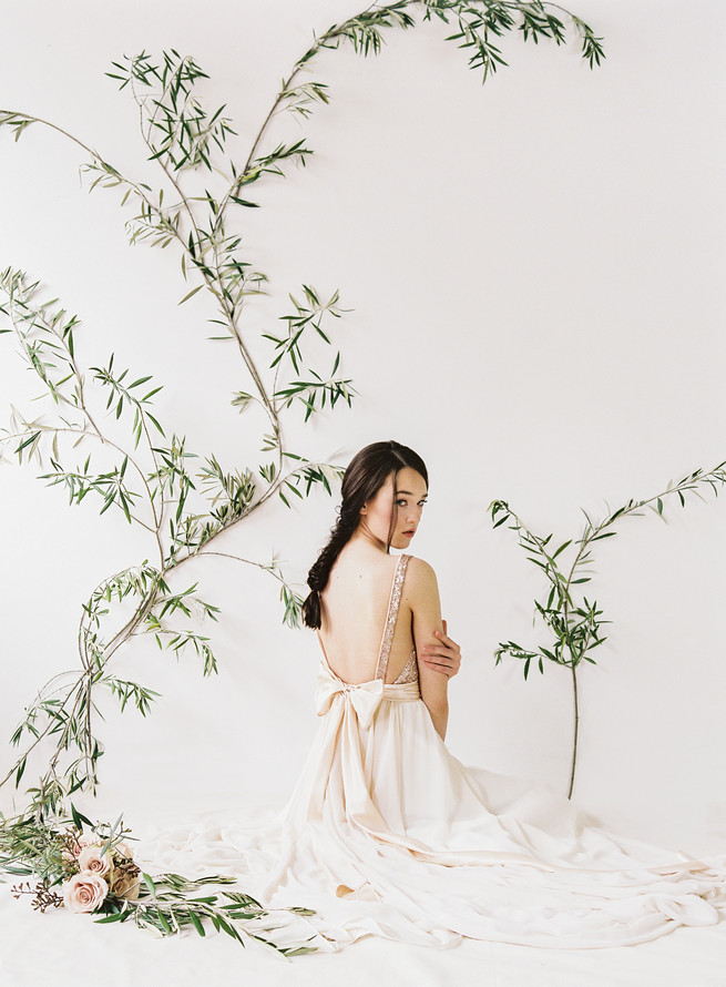 Rose gold glittering Eden sequin wedding dress with v neck front and tulle skirt. Truvelle Wedding Dress by Blush Wedding Photography