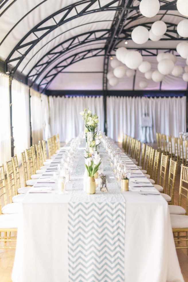 DIY painted bottles and jars in white and gold. White and Gold DIY Chevron Wedding, South Africa, by Claire Thomson Photography