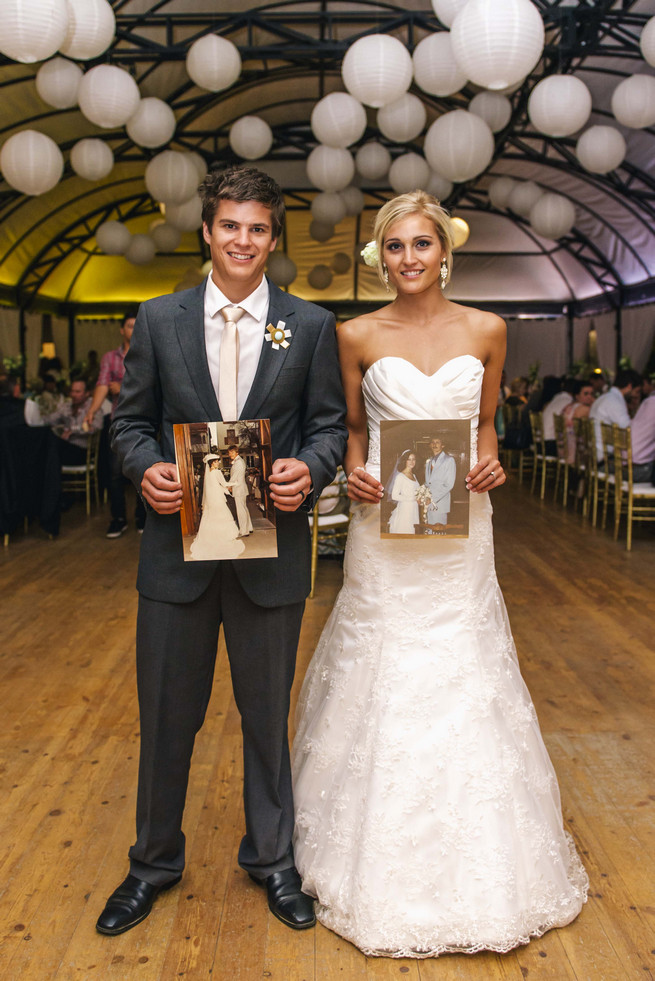 Bride and groom with photographs of their parents at their wedding, Great wedding photo idea!