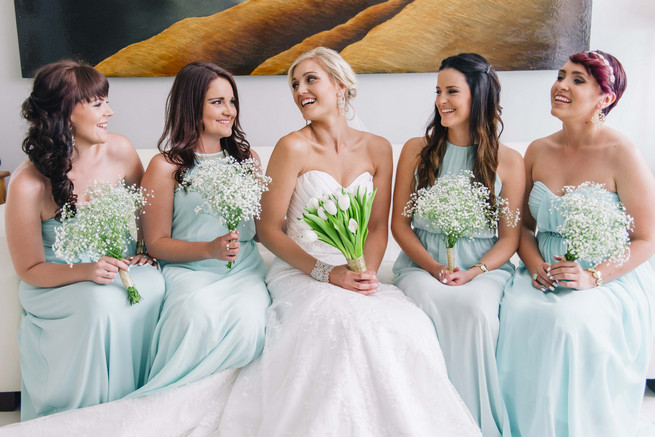 Bride and bridesmaids in mint gowns with babys breath bouquets. White and Gold DIY Chevron Wedding, South Africa, by Claire Thomson Photography