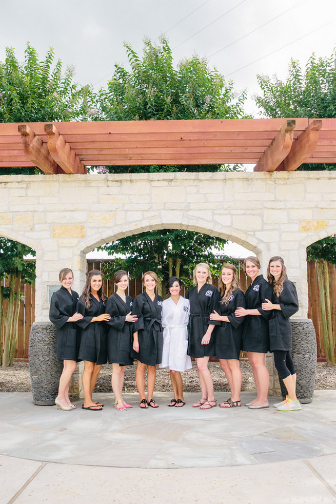 Bridesmaids in their monogrammed robes. Cute Coral Gray wedding at Briscoe Manor, Houston, by Luke and Cat Photography